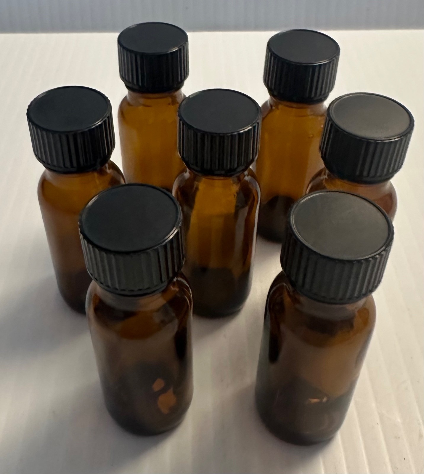 Boston Round 1/2 oz Amber Glass Bottles With Poly Lined Black Caps