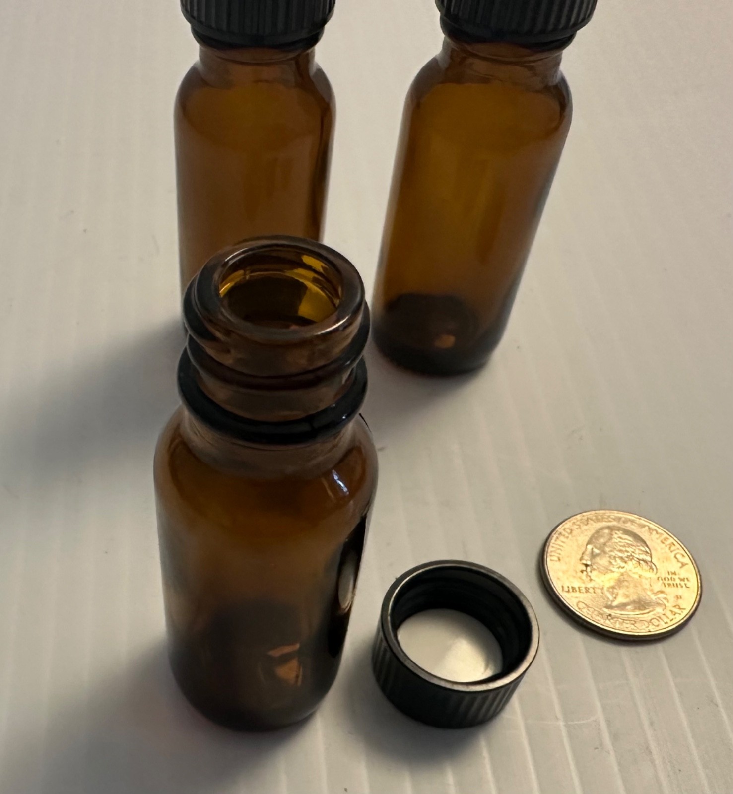 Boston Round 1/2 oz Amber Glass Bottles With Poly Lined Black Caps
