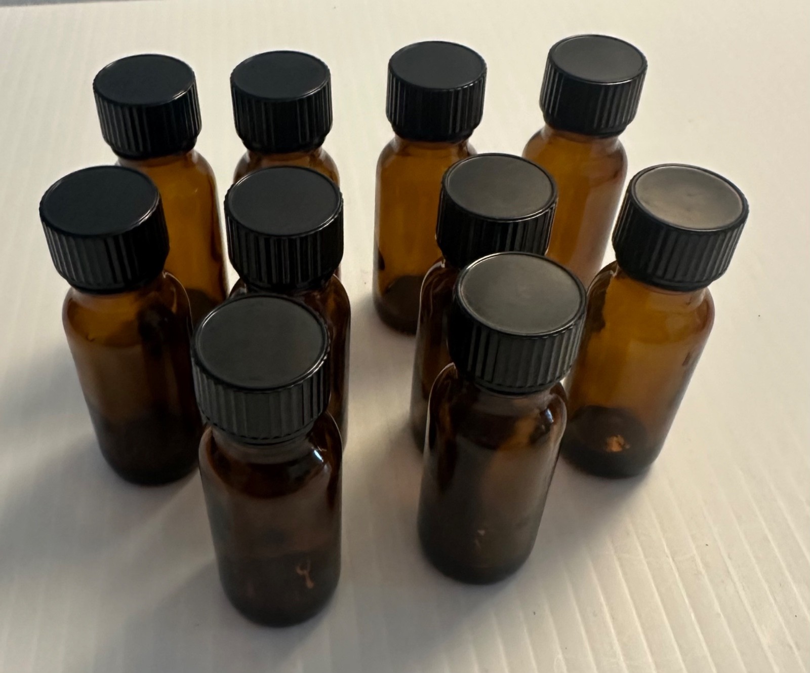 Boston Round 1/2 oz Amber Glass Bottles With Poly Lined Black Caps