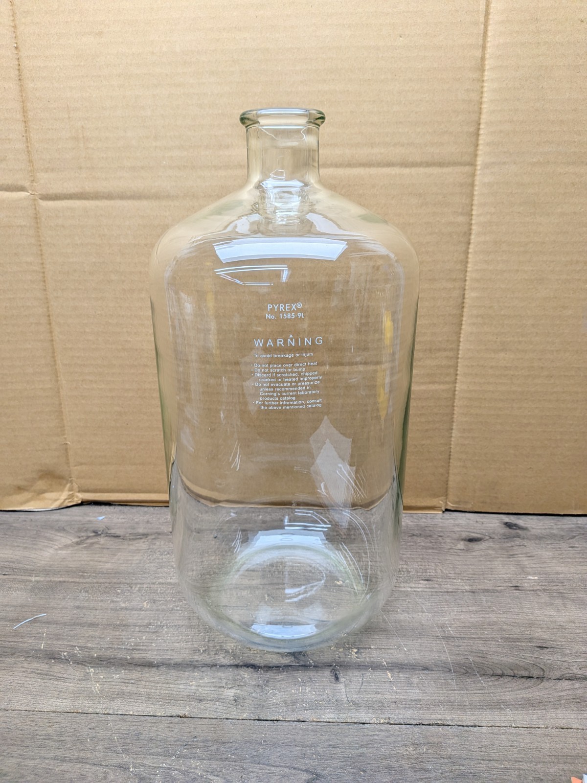 NOS PYREX 1585-9L is a heavy-wall, 9-liter borosilicate glass serum bottle